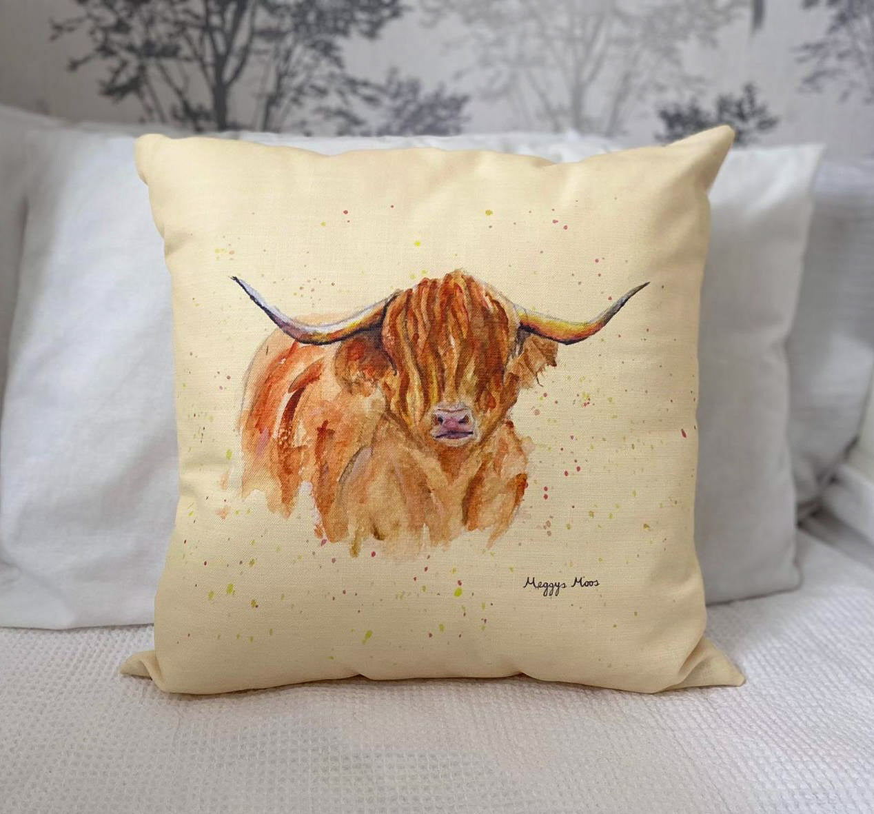 morag highland cow cushion with golden background. Highland cow gifts and homeware range